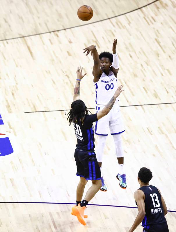 Golden State's Jonathan Kuminga (00) shoots over Orlando's Cole Anthony (50) during the first h ...