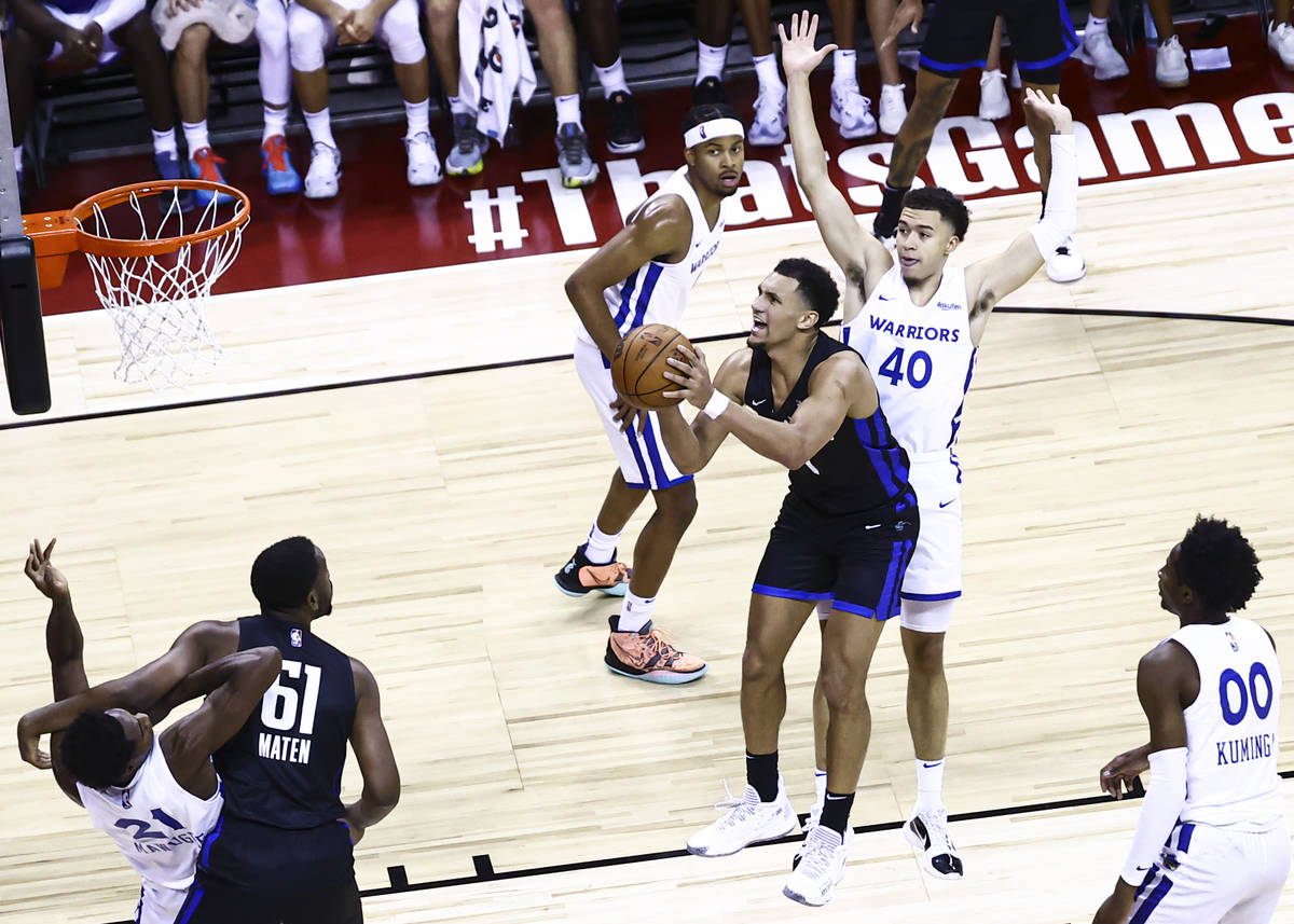 Orlando Magic's Jalen Suggs looks to shoot in front of Golden State Warriors' Jaquori McLaughli ...