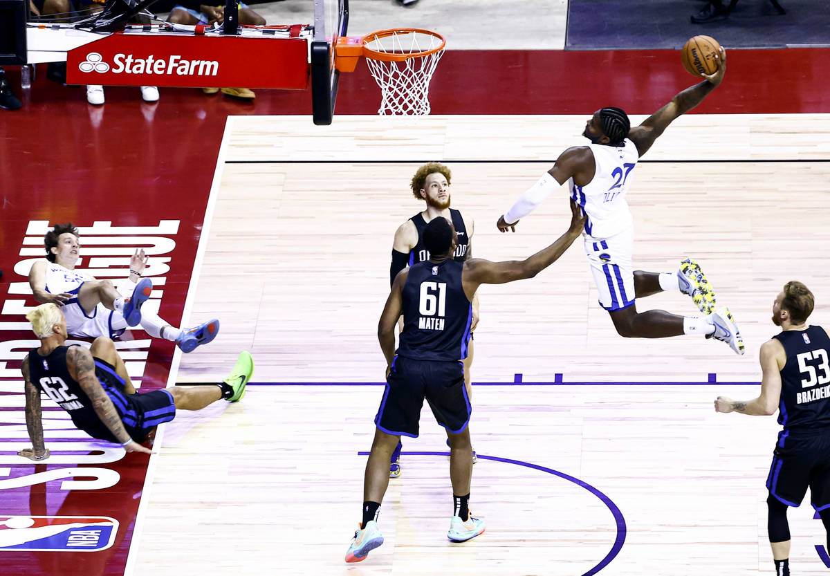 Golden State' Warriors' Cameron Oliver (27) goes to the basket to dunk against Orlando Magic's ...