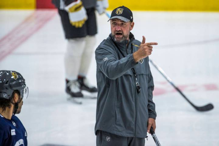 Vegas Golden Knights head coach Peter DeBoer instructs his players while running a new drill du ...