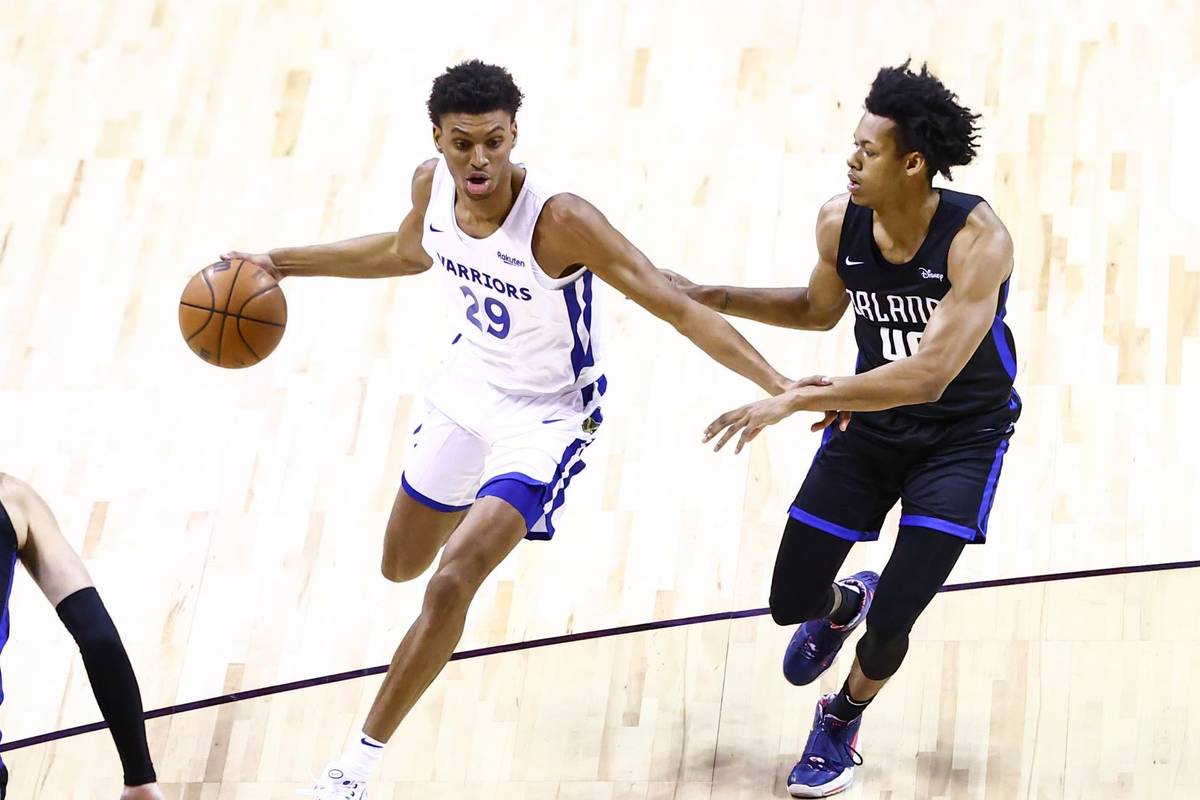 Golden State's Derrick Alston Jr. (29) drives the ball around Orlando's Jeff Dowtin (40) agains ...