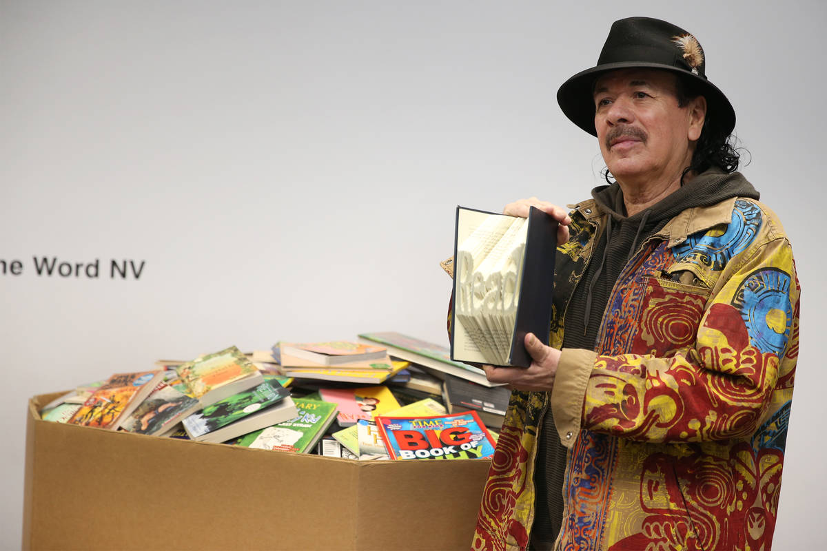 Carlos Santana poses for a photo during a visit to the Spread the Word Nevada offices and wareh ...