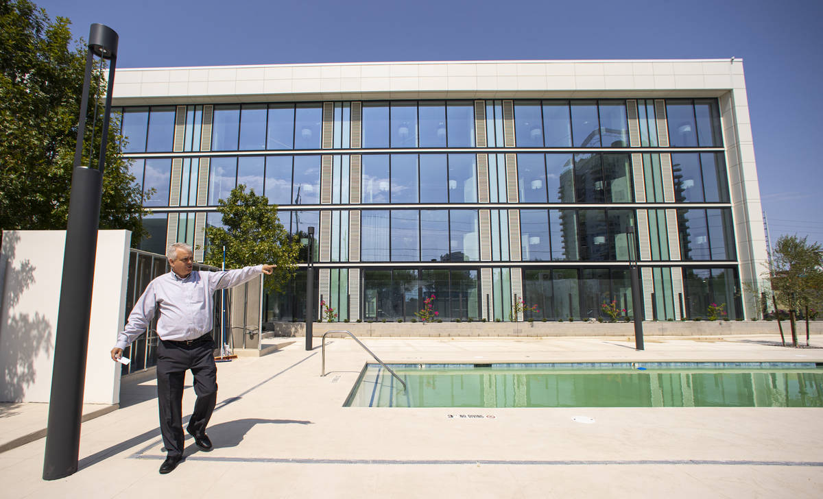 Steve Dennis, general manager of The English Hotel, walks around the pool area during a tour of ...