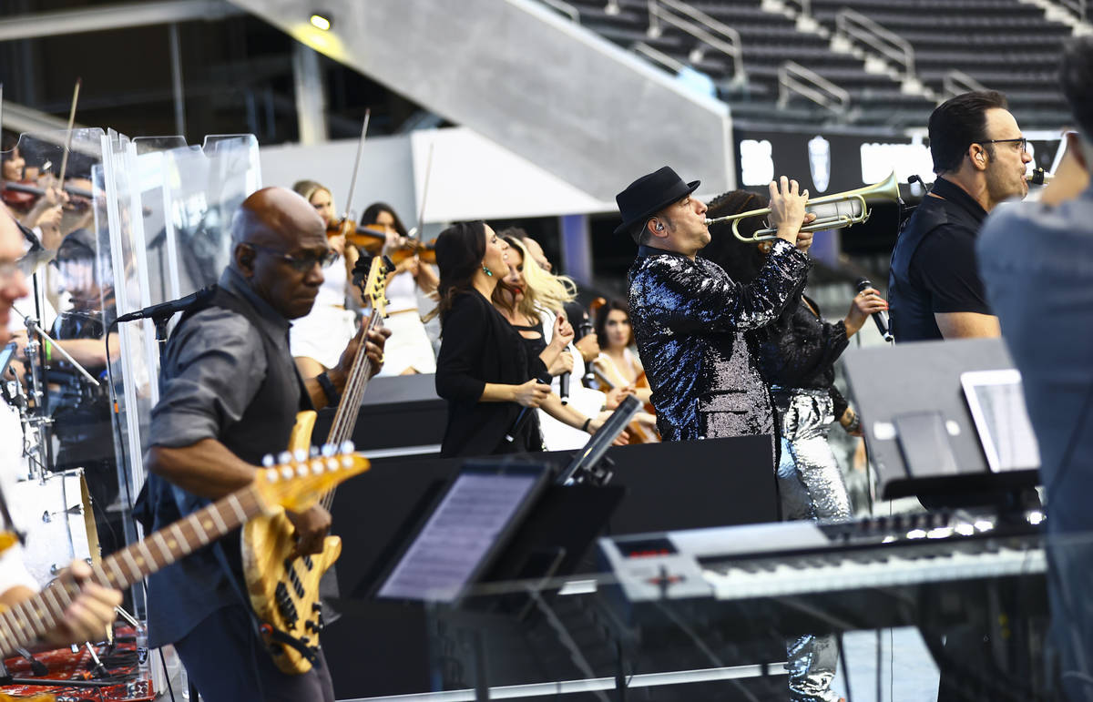 Members of David Perrico's Pop Strings band perform at Allegiant Stadium in Las Vegas on Monday ...