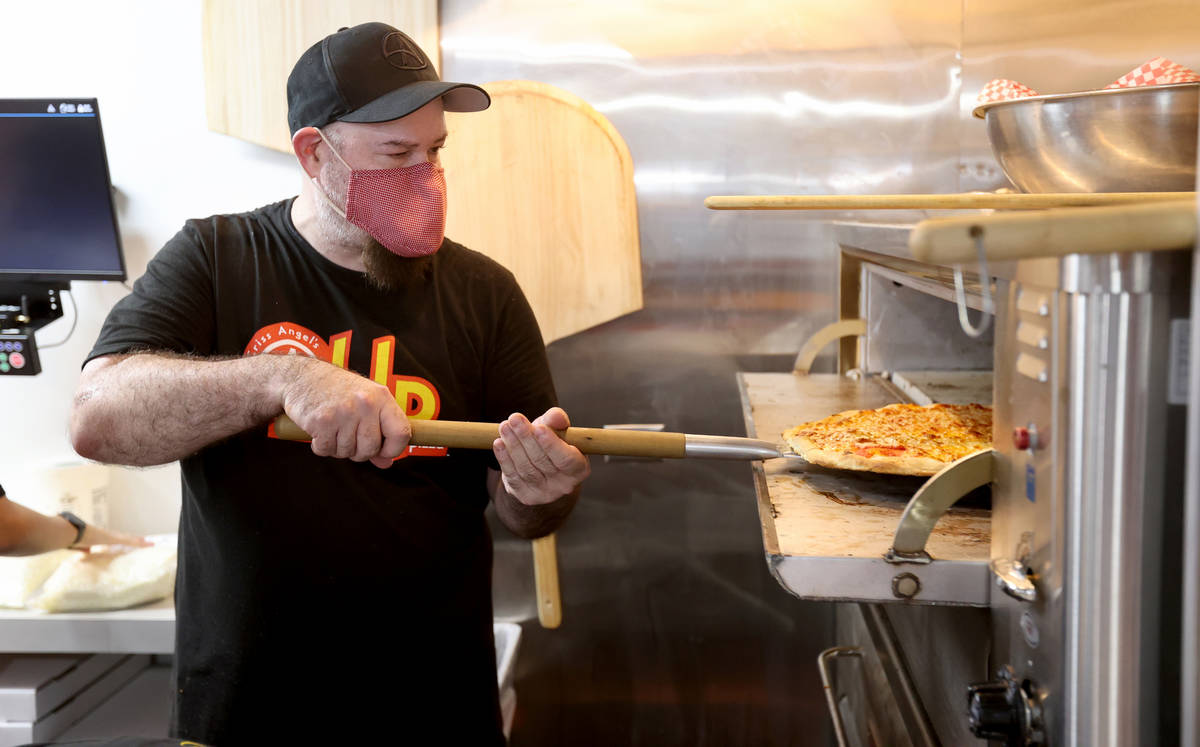 Criss Angel partner Michael Baram makes pizza at their new restaurant, CABLP, in Overton during ...