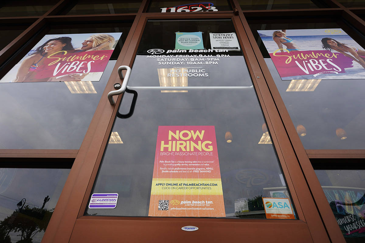 A Now Hiring sign at a business in Richmond, Va., Wednesday, June 2, 2021. U.S. employers poste ...