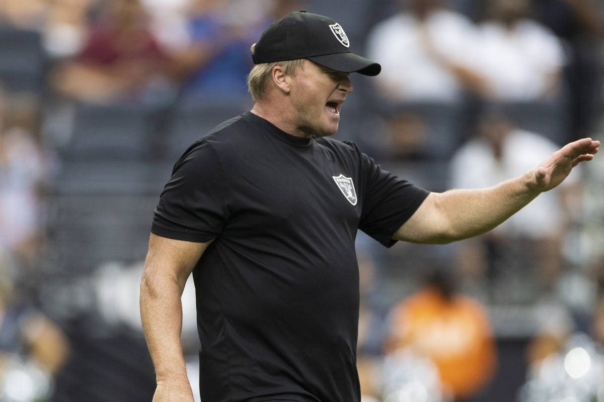 Raiders head coach Jon Gruden calls a play during a special training camp practice for season t ...