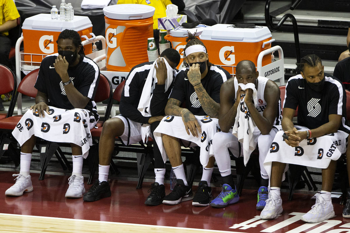 Portland Trail Blazers players, including Kenneth Faried, left, Emmanuel Mobiay, second from le ...