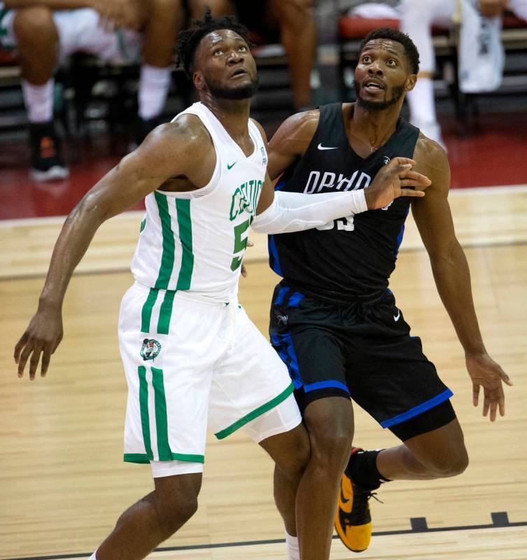 Orlando Magic forward Shakur Juiston (62) guards Boston Celtics forward Bruno Fernando (55) dur ...