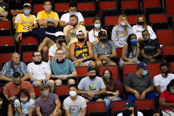 Some fans wear masks to prevent the spread of COVID-19 while others refrain during the second h ...