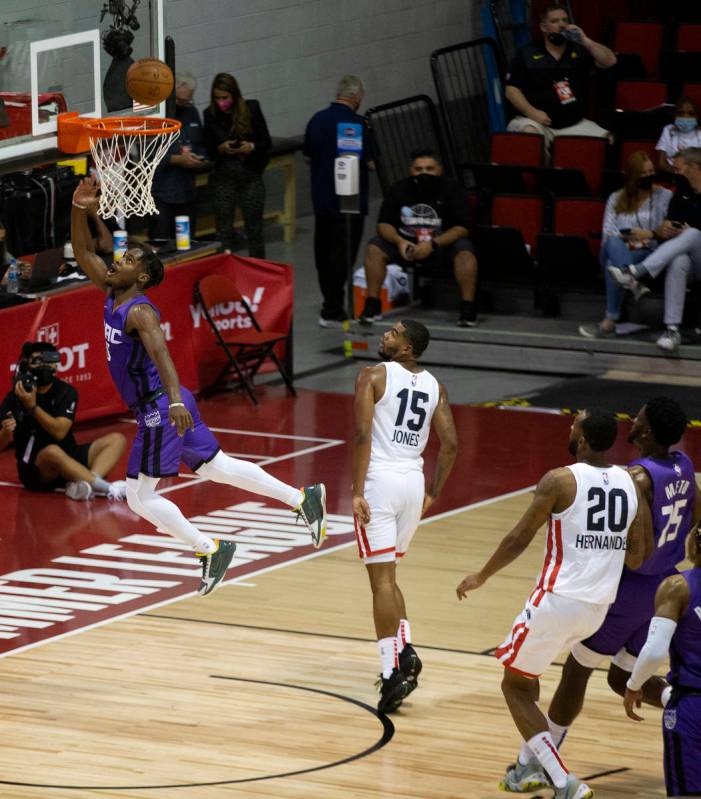 Sacramento Kings guard Davion Mitchell (15) jumps for a layup during the first half of an NBA S ...