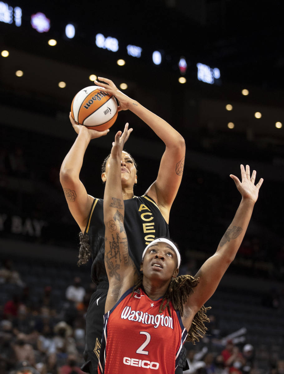 Las Vegas Aces center Liz Cambage (8) shoots over Washington Mystics forward Myisha Hines-Allen ...