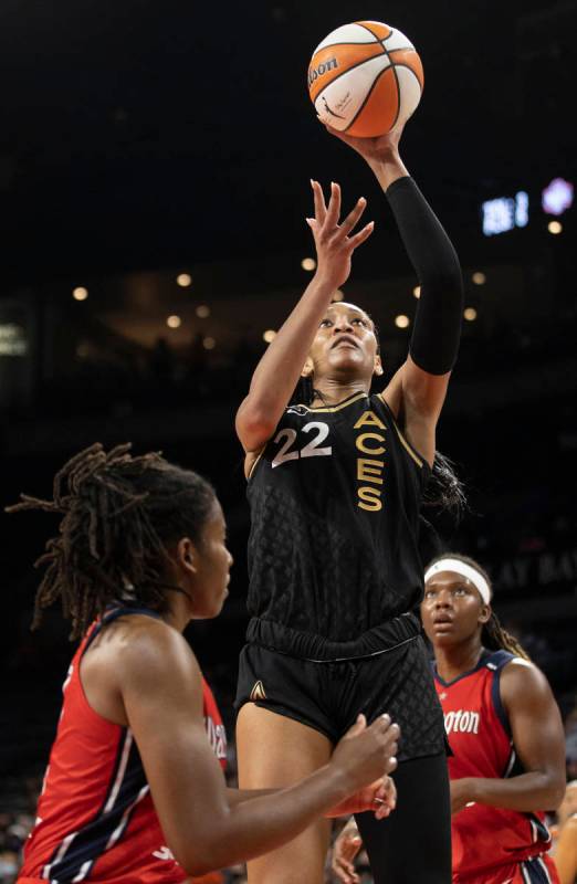 Las Vegas Aces forward A'ja Wilson (22) shoots over Washington Mystics guard Ariel Atkins (7) a ...