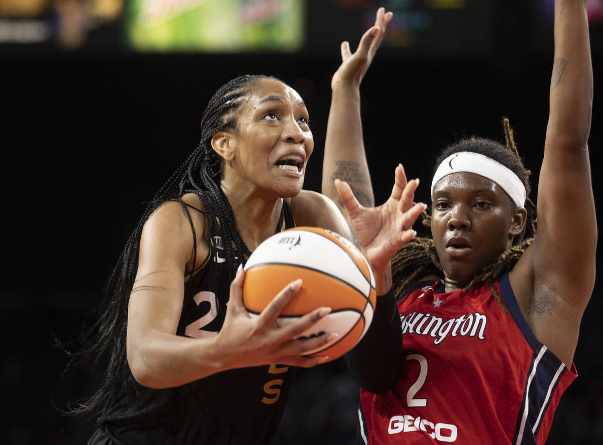 Las Vegas Aces forward A'ja Wilson (22) drives past Washington Mystics forward Myisha Hines-All ...