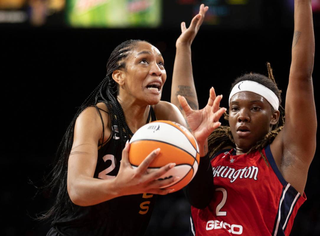 Las Vegas Aces forward A'ja Wilson (22) drives past Washington Mystics forward Myisha Hines-All ...