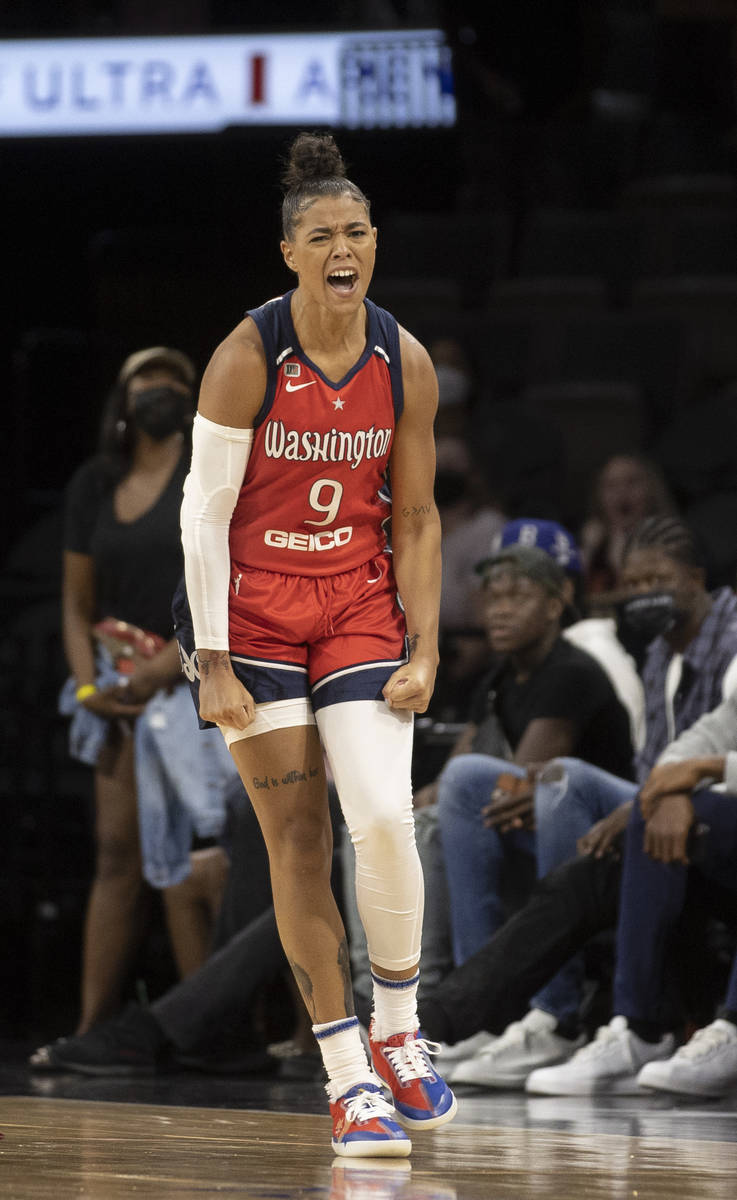 Washington Mystics guard Natasha Cloud (9) celebrates after making a shot and getting fouled in ...