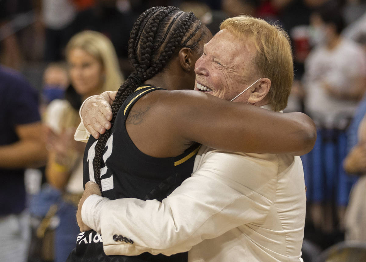 Las Vegas Aces guard Chelsea Gray (12) hugs Raiders owner Mark Davis after Gray hit the winning ...