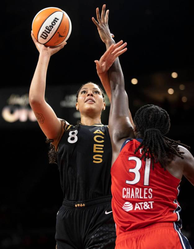 Las Vegas Aces center Liz Cambage (8) shoots over Washington Mystics center Tina Charles (31) i ...