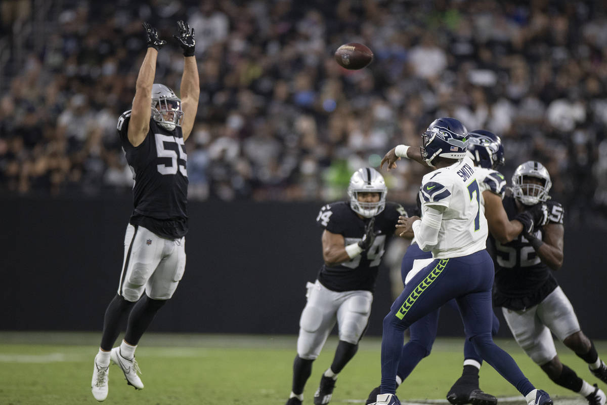 Raiders linebacker Tanner Muse (55) leaps to try and block a pass from Seattle Seahawks quarter ...