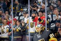 Golden Knights fans get pumped up as goaltender Marc-Andre Fleury (29) and teammates take the i ...