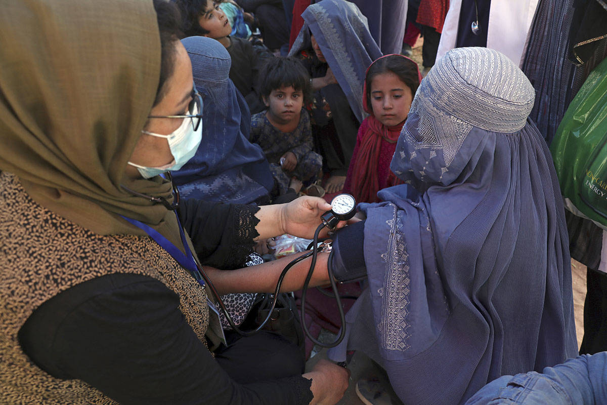 FILE - In this Aug. 10, 2021 file photo, an internally displaced woman from northern provinces, ...