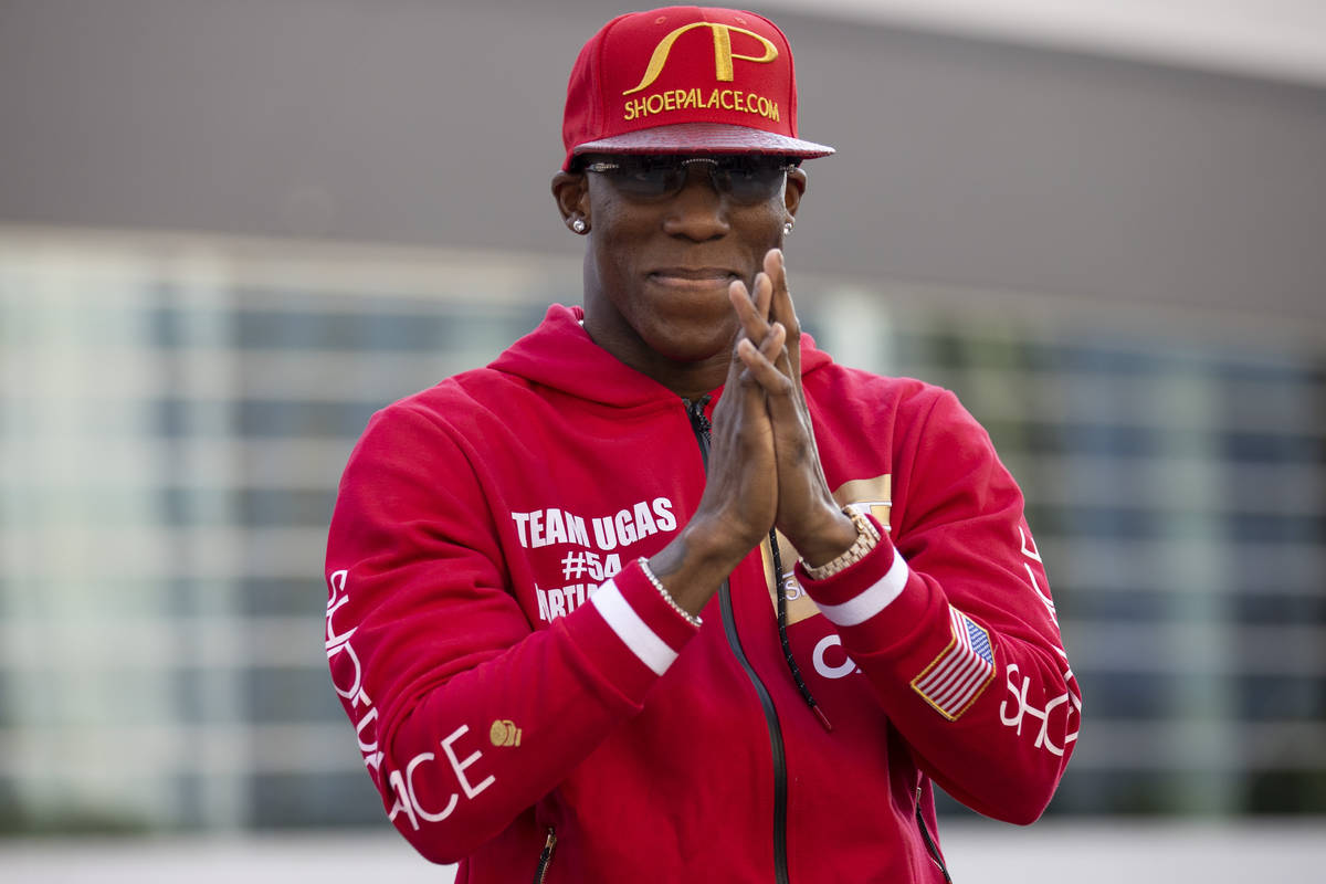 Yordenis Ugas gestures to the crowd during his grand arrival at Toshiba Plaza in Las Vegas, Tue ...