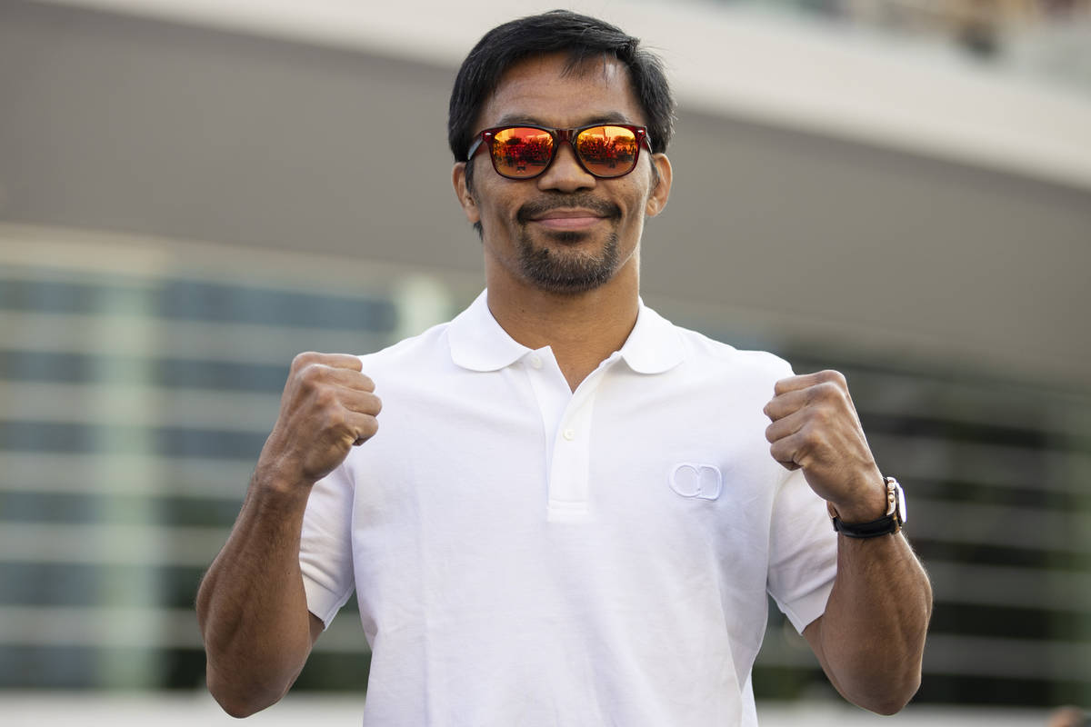 Manny Pacquiao poses during his grand arrival at Toshiba Plaza in Las Vegas, Tuesday, Aug. 17, ...