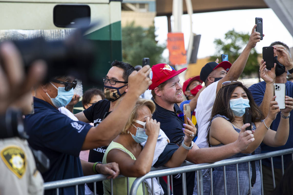 Fans watch Manny Pacquiao take the stage during his grand arrival at Toshiba Plaza in Las Vegas ...