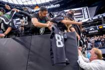 Raiders owner Mark Davis signs autographs for fans before the Raiders home opening pre-season N ...