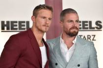 Alexander Ludwig, left, and Stephen Amell arrive at the premiere of "Heels" on Tuesda ...
