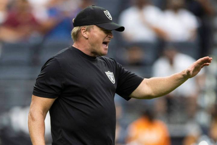 Raiders head coach Jon Gruden calls a play during a special training camp practice for season t ...