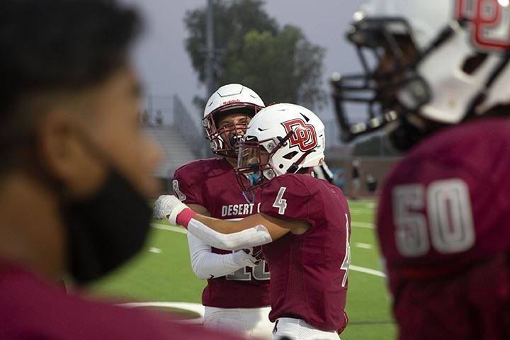 Desert Oasis wide receiver Avery Aliaga (11) and running back Isaiah Flasher (4) celebrate afte ...