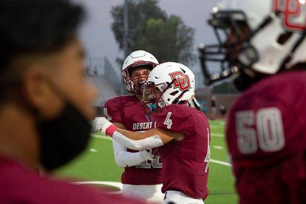 Desert Oasis wide receiver Avery Aliaga (11) and running back Isaiah Flasher (4) celebrate afte ...