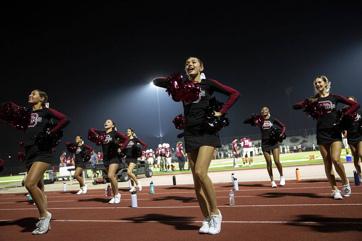 Desert Oasis cheerleaders encourage their team during a high school football game against Sprin ...