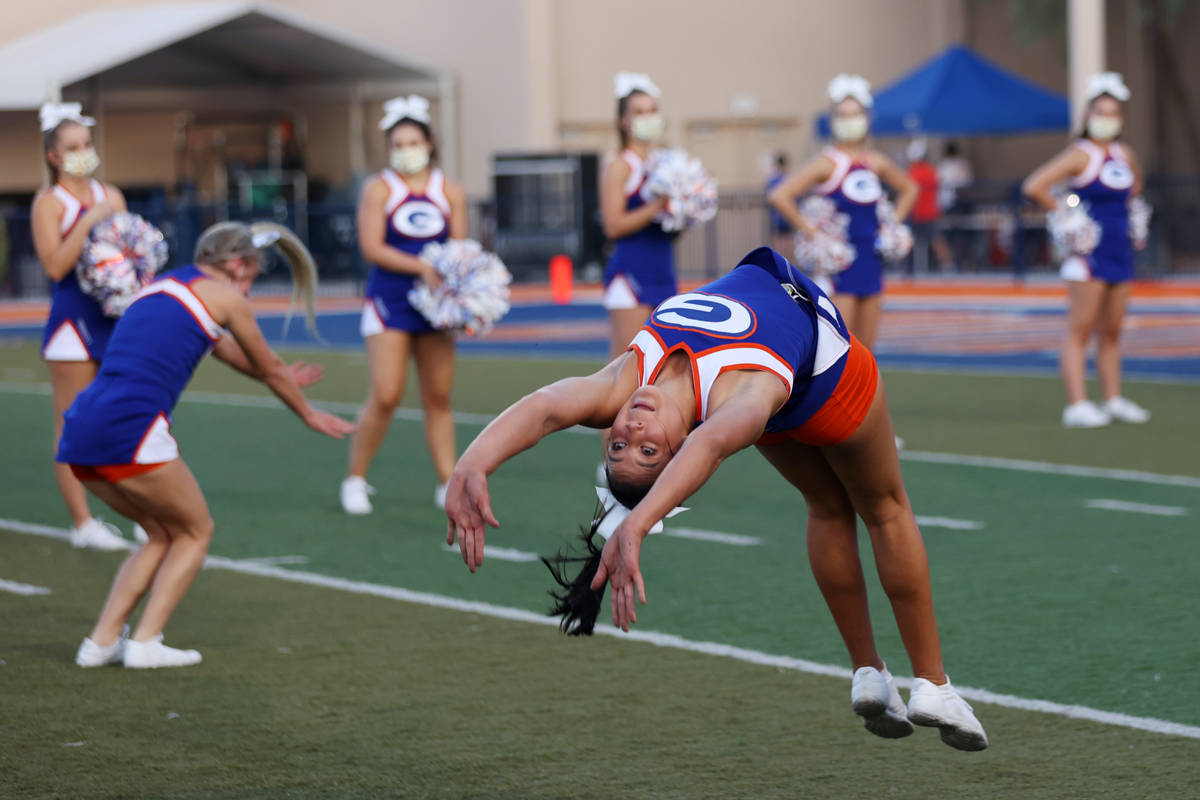 Cheerleaders perform before the start of a football game between Bishop Gorman and St. Louis of ...