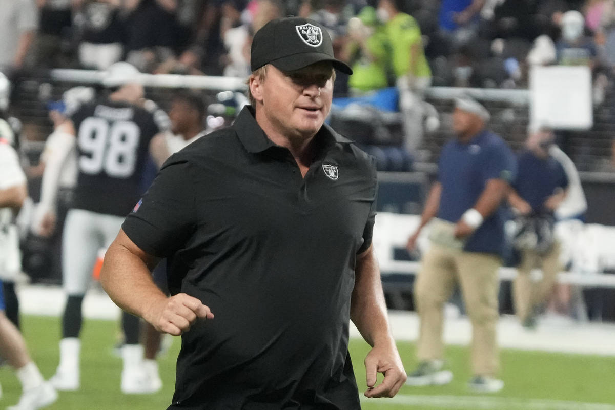 Las Vegas Raiders head coach Jon Gruden runs off the field after an NFL preseason football game ...