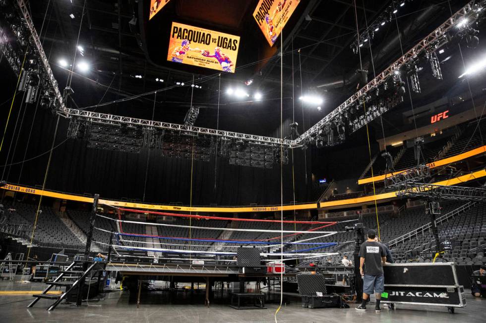 Crews set up the boxing ring for the upcoming boxing main event between Manny Pacquiao and Yord ...