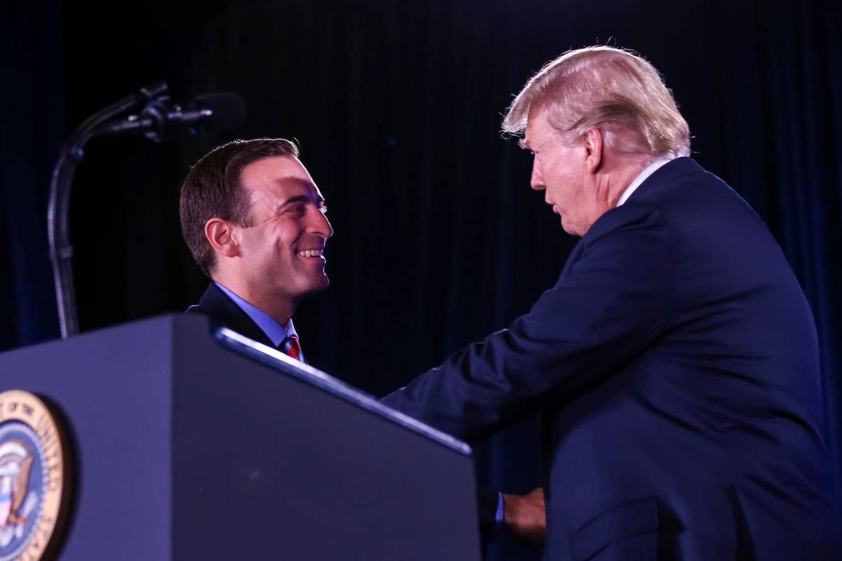 President Donald Trump greets Nevada Attorney General Adam Laxalt during the keynote address at ...