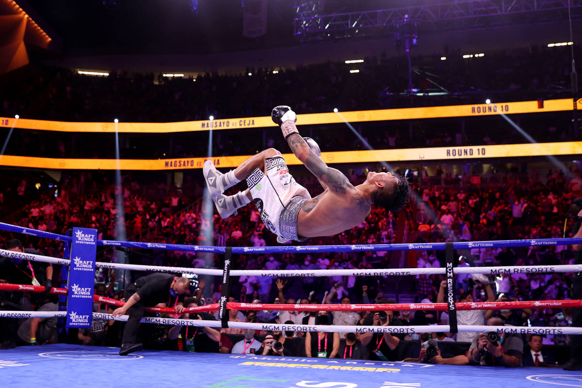 Mark Magsayo celebrates his 10th round knockout win against Julio Ceja in the featherweight bou ...