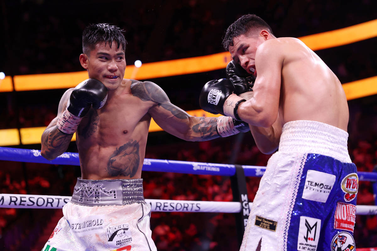 Mark Magsayo connects a punch against Julio Ceja in the ninth round of the featherweight bout a ...