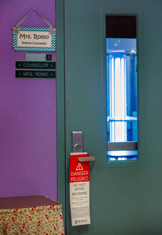 Warning placards are hung on doors when an R-Zero 372 Arc UV-C system is in use, the Clark Coun ...