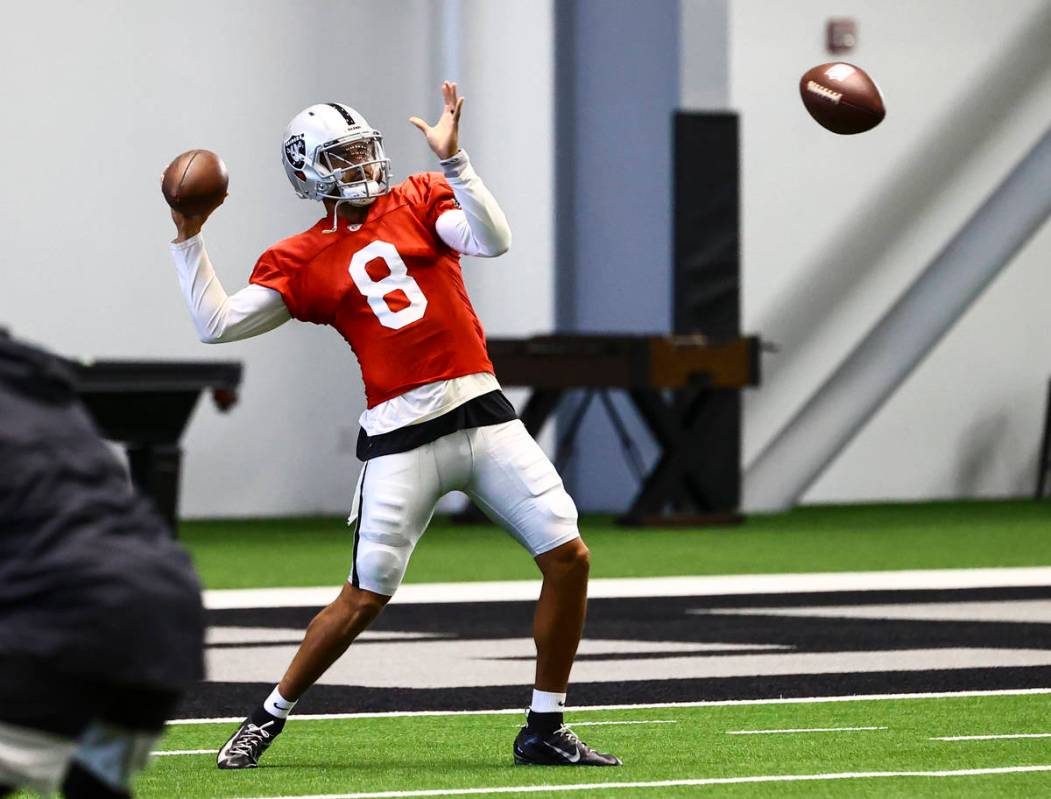 Raiders quarterback Marcus Mariota throws a pass during training camp at Raiders Headquarters/I ...