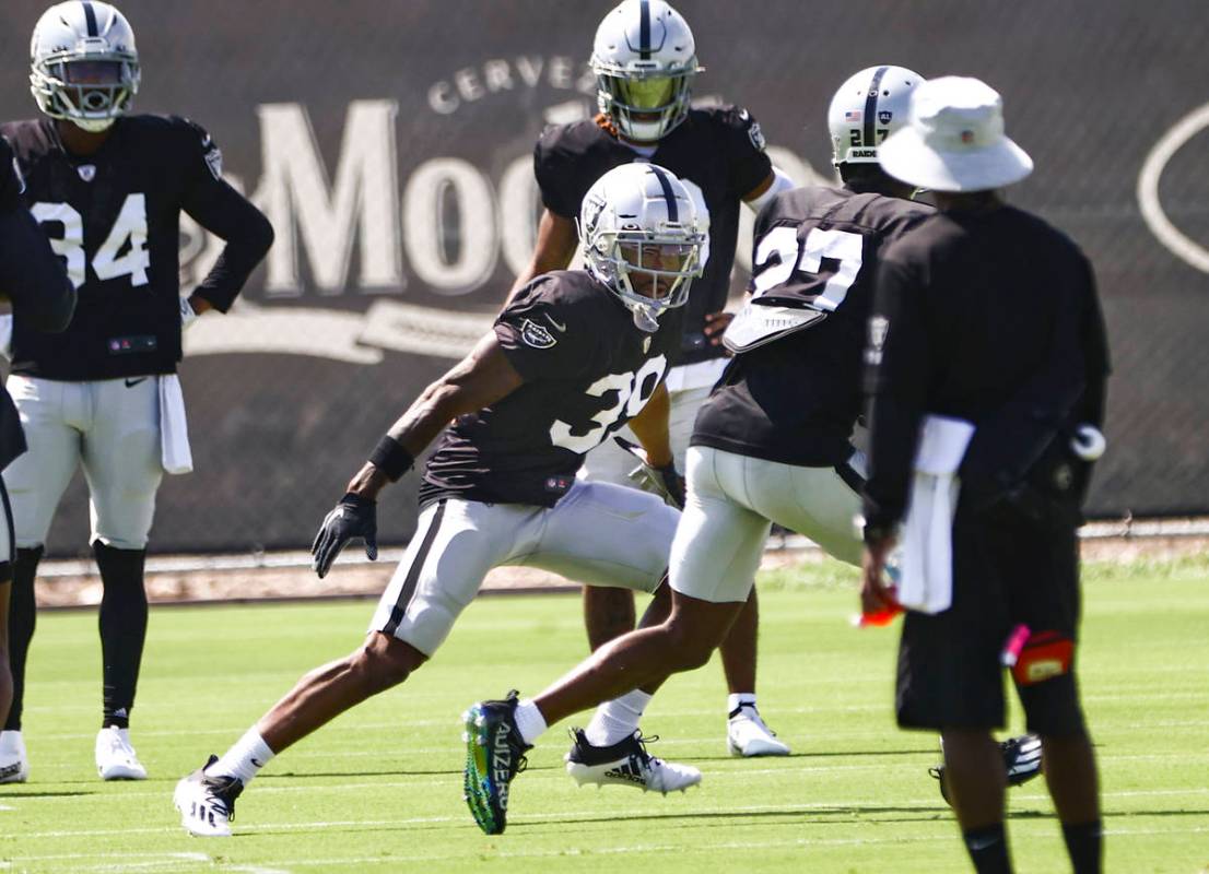 Raiders cornerbacks Nate Hobbs, left, and Trayvon Mullen participate in drills during training ...