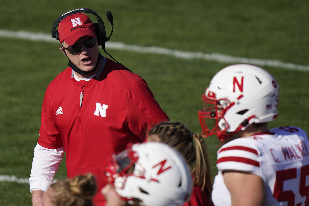 Nebraska head coach Scott Frost talks to his team during the first half of an NCAA college foot ...