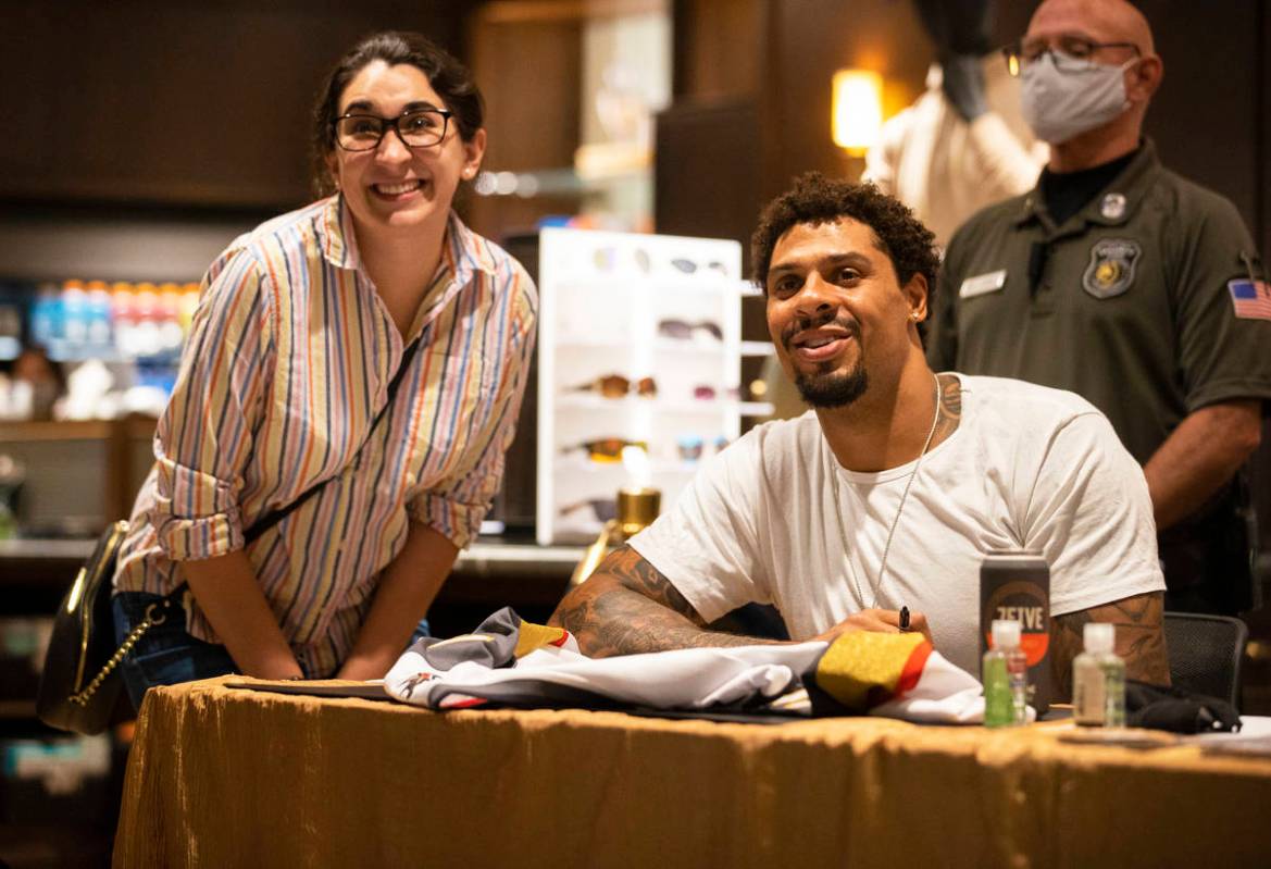 Former Golden Knights player Ryan Reaves, right, takes a photo with Carla Millares during a Sen ...