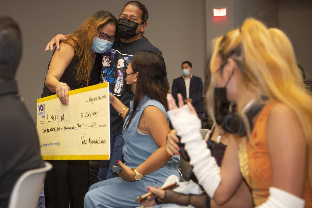 Loreta Mercado hugs her brother-in-law Carlos Mercado after winning $250,000 during the final V ...