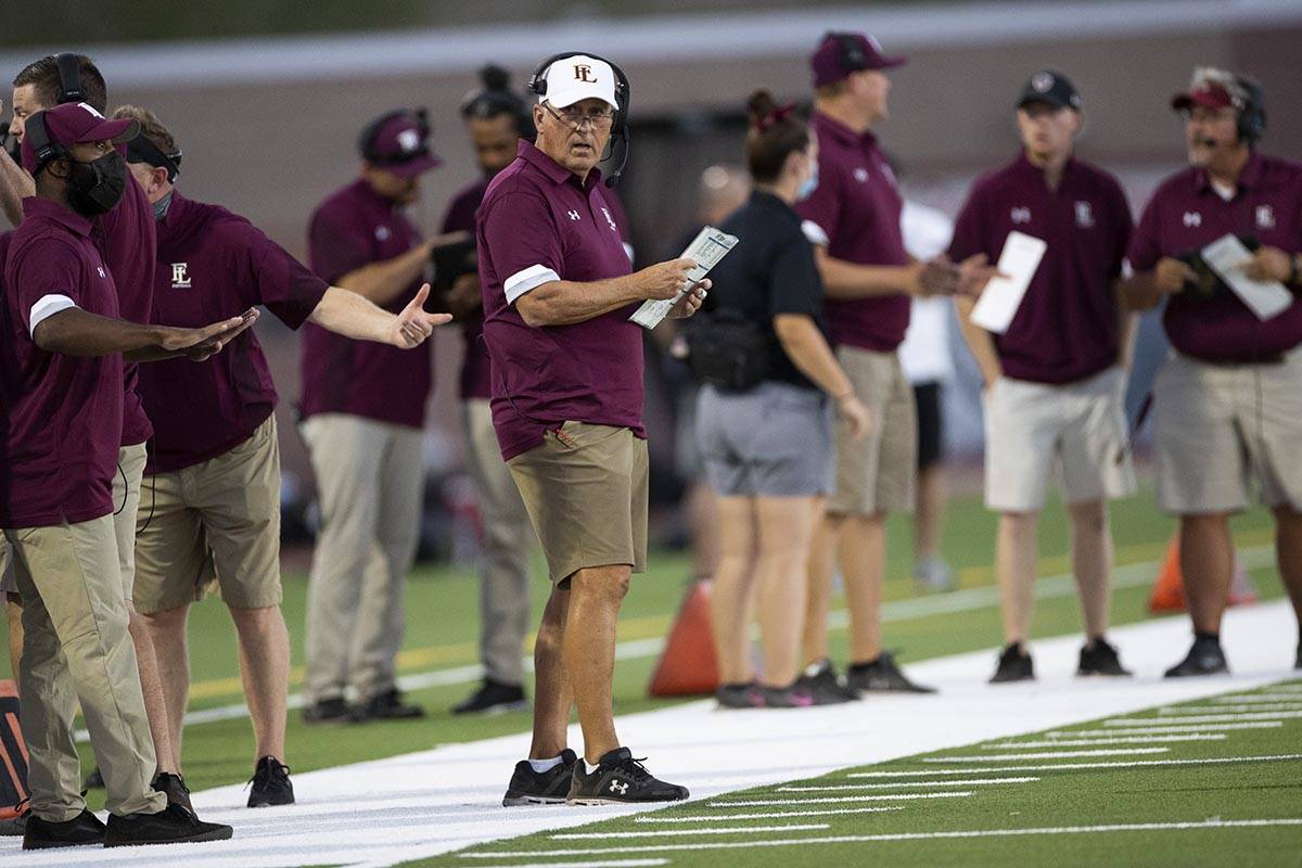 Faith Lutheran's head coach Mike Sandford watches his team play Arbor View during the first hal ...