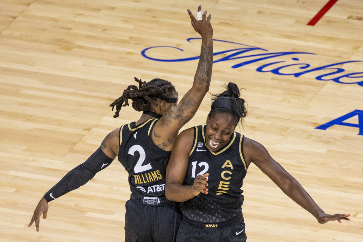 Las Vegas Aces guard Riquna Williams (2) and teammate guard Chelsea Gray (12) celebrate anothe ...