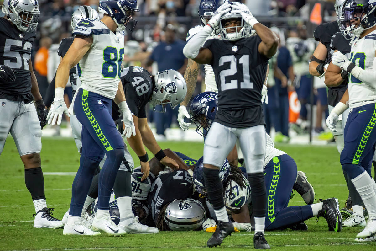 Raiders cornerback Amik Robertson (21) reacts to an early hit penalty as Seattle Seahawks wide ...