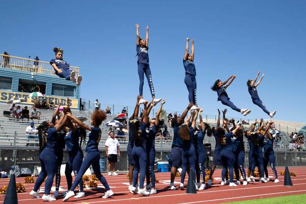 Cheyenne cheerleaders perform stunts during a football game against Clark High School at Cheyen ...